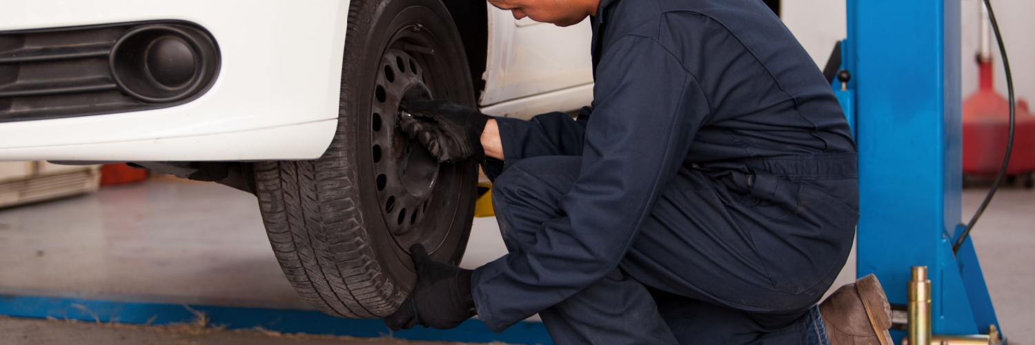 mechanic conducting a tire rotation